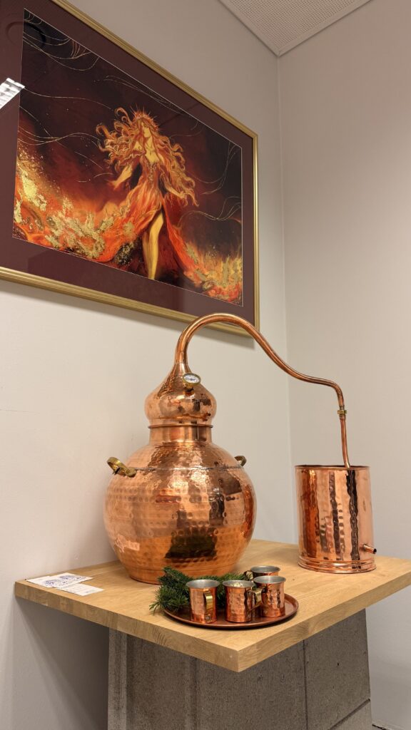 Copper still displayed as part of the Quintessence artwork visualizing the process of alchemy and distillation.